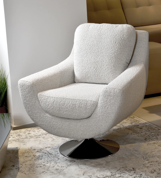 Armchair upholstered in fabric with swivel base.