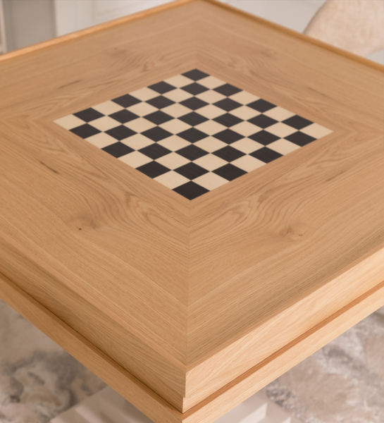 Game table with natural oak top and pearl lacquered foot.