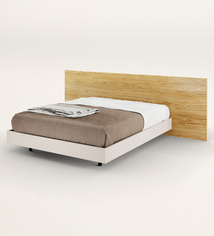 Double bed with headboard in natural oak and suspended base in pearl.