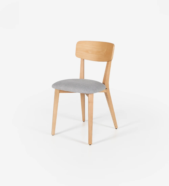 Chair in natural ash wood with fabric upholstered seat.