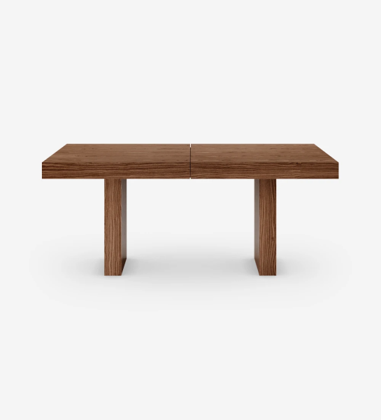 Rectangular extendable dining table in walnut.