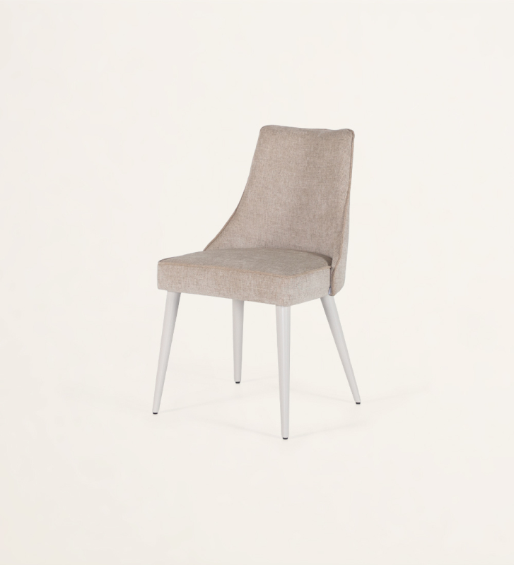Fabric upholstered chair with pearl lacquered feet.