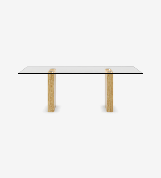 Rectangular dining table with glass top, legs in natural oak.