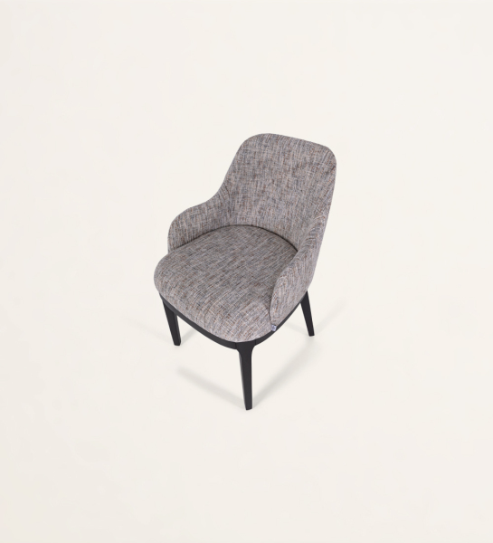 Chair with armrest upholstered in fabric, with black lacquered wooden feet.