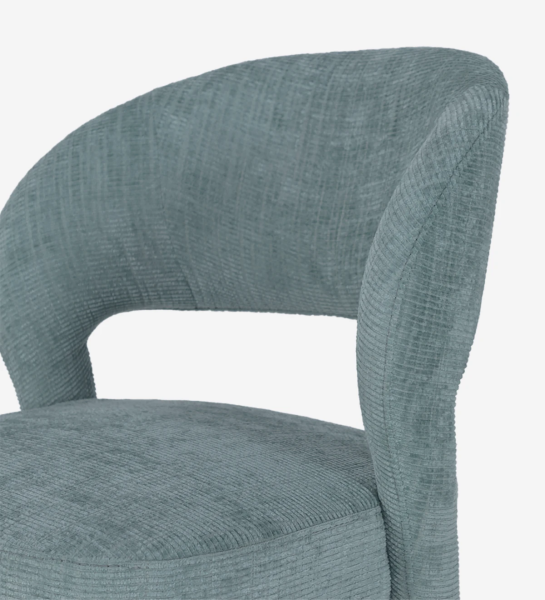 Chair upholstered in fabric.