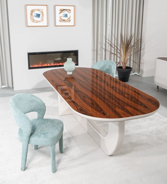 Oval dining table with high gloss palissander top and pearl lacquered foot.