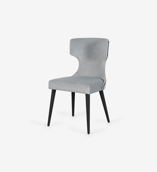 Fabric upholstered chair, with black tack on the back and anthracite lacquered feet.