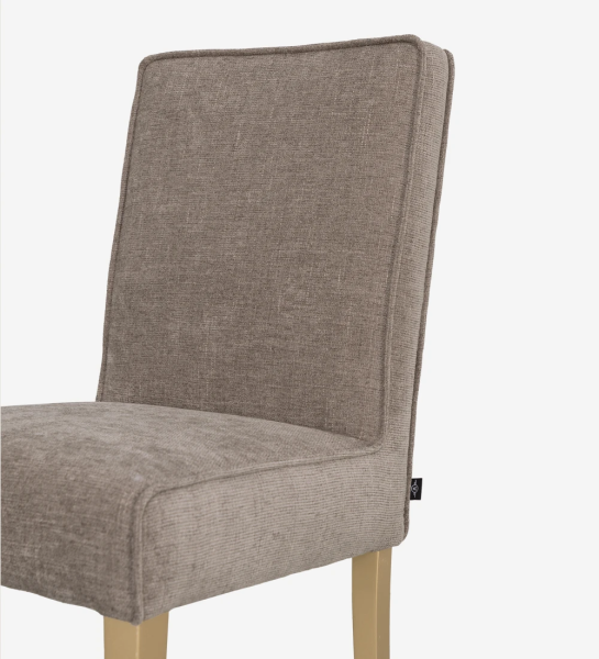 Chair upholstered in fabric, with feet lacquered in gold.