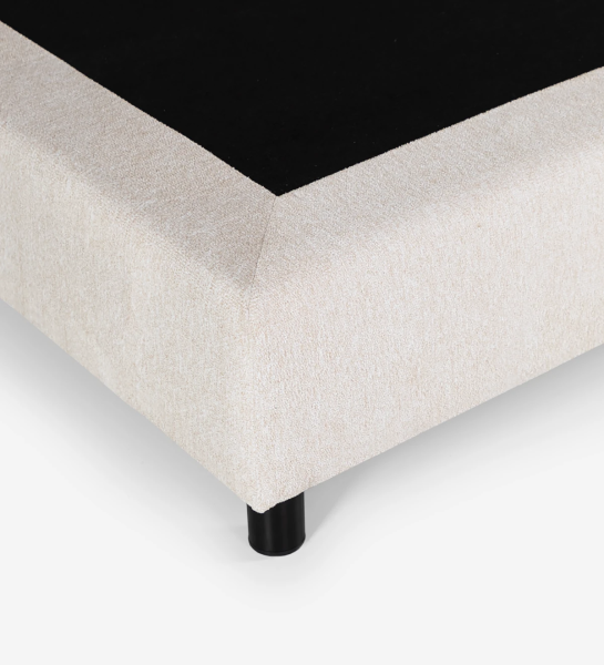 Simple double sommier, divided horizontally, upholstered in fabric.