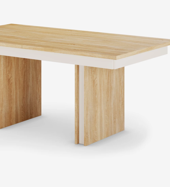 Rectangular extendable dining table in natural oak and pearl detail.