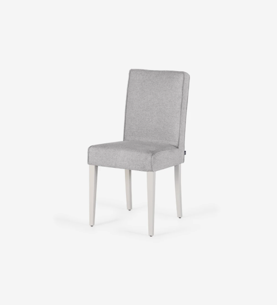 Chair upholstered in fabric, with feet lacquered in pearl.