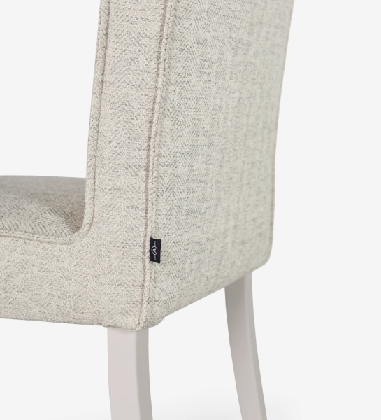 Chair upholstered in fabric, with feet lacquered in pearl.