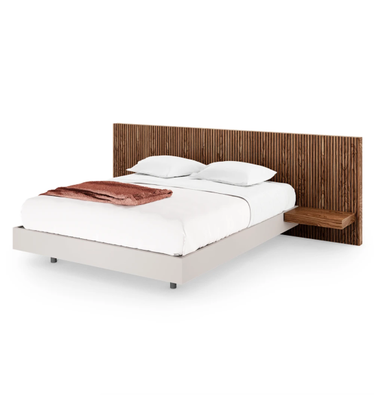 Double bed with headboard with friezes and walnut shelves, suspended base in pearl.