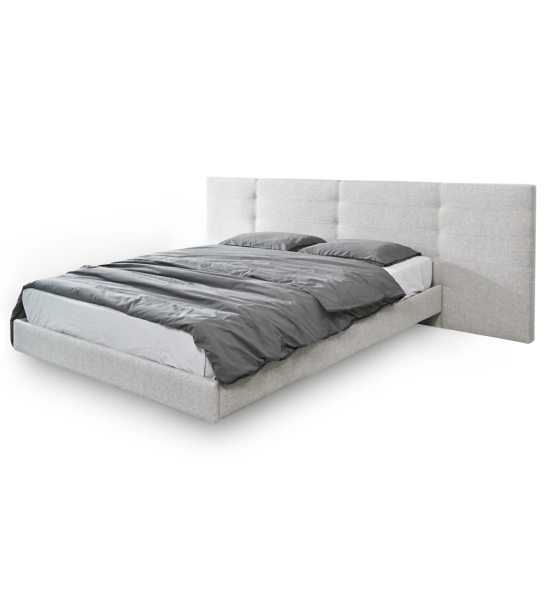 Double bed with long headboard, upholstered in fabric, with hanging backboard.