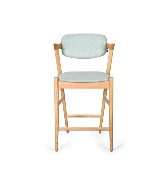 Stool in natural colored ash wood, with seat and back upholstered in fabric.