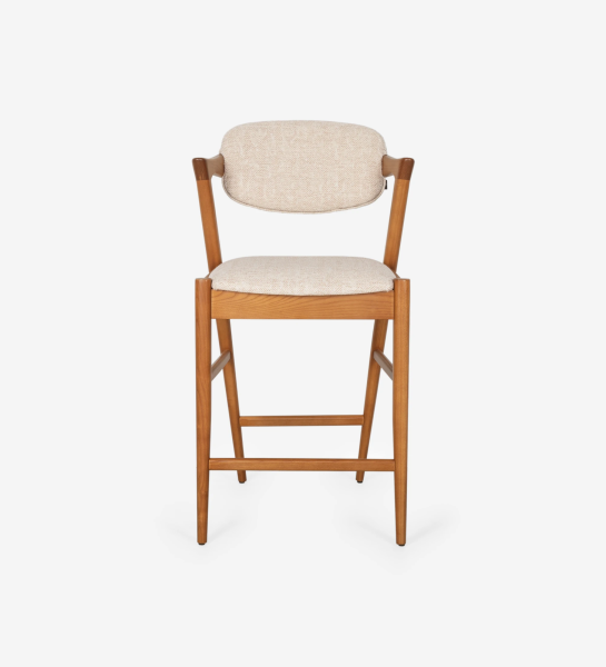 Stool in honey-colored ash wood, with seat and back upholstered in fabric.
