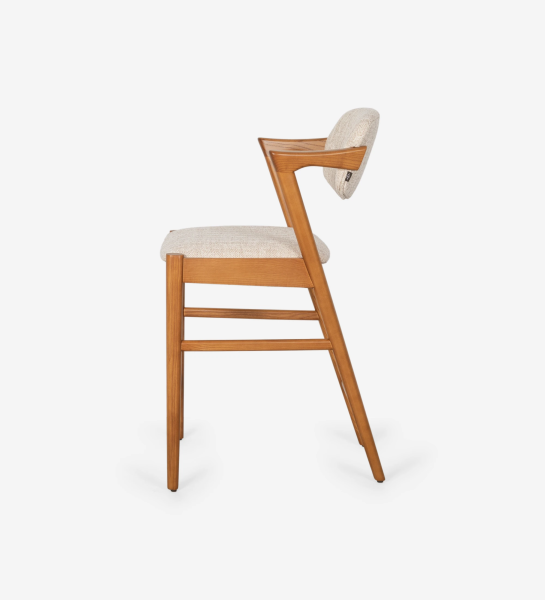 Taburete en madera de fresno color miel, con asiento y respaldo tapizado en tejido.
