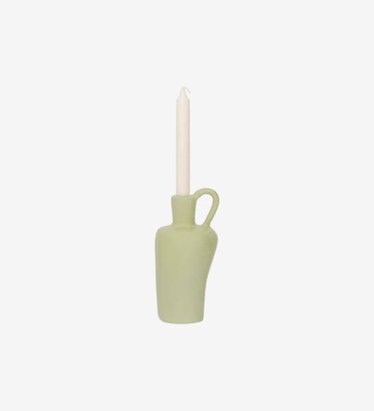 Light green candle holder, with structure made of recycled paper pulp, natural gum and chalk powder.