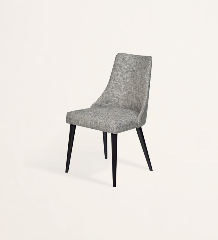 Chair upholstered in fabric, with black lacquered feet.