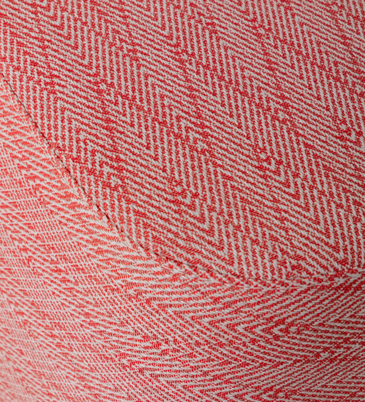 Red fabric upholstered stool, black feet.