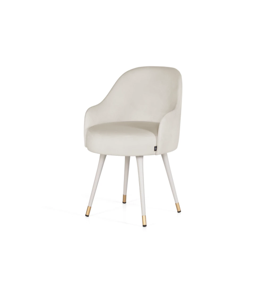 Beige fabric upholstered swivel chair with pearl lacquered feet and gold detailing.