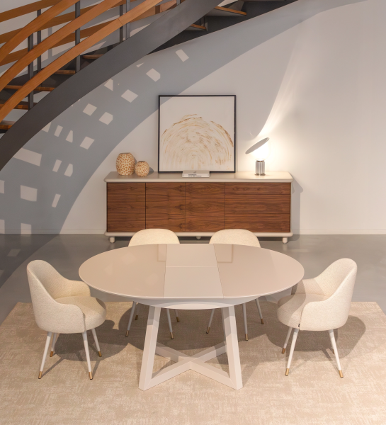 Round extendable dining table in pearl lacquer with glass top and pearl lacquer extension.