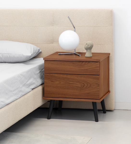 Oslo bedside table with 2 drawers and structure in natural walnut veneer. Black lacquered legs. Dimensions: 55 x 57.5 cm.