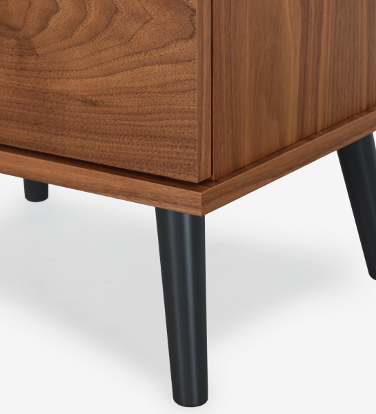 Oslo bedside table with 2 drawers and structure in natural walnut veneer. Black lacquered legs. Dimensions: 55 x 57.5 cm.