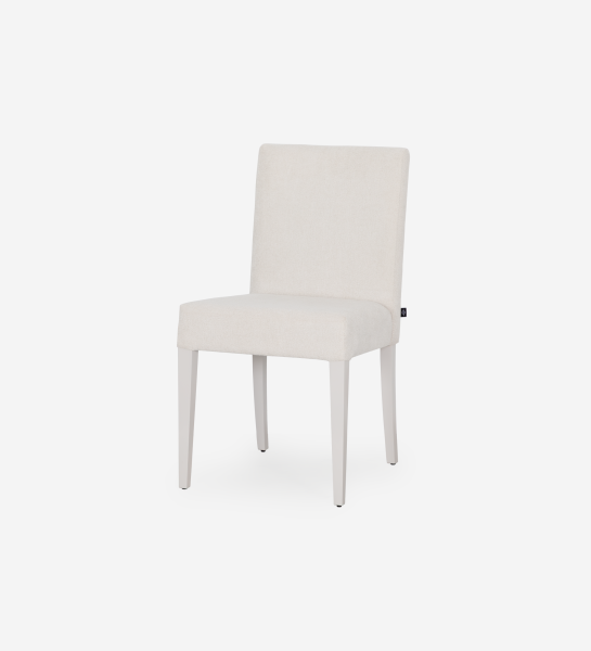 Chair upholstered in fabric, pearl lacquered feet.