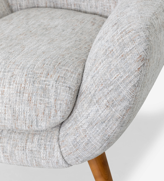 Oslo armchair upholstered in grey velvet-like fabric, with honey-coloured ash wood legs.