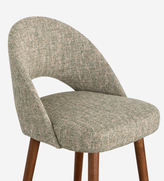 Stool upholstered in green fabric, with walnut-colored wood leg.