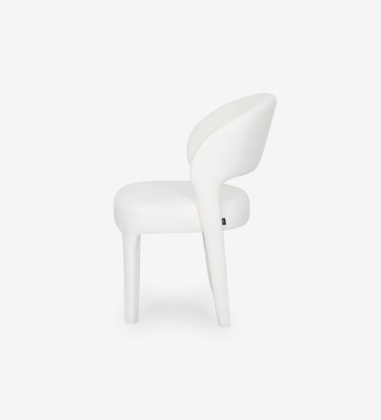 Chair upholstered in white fabric.