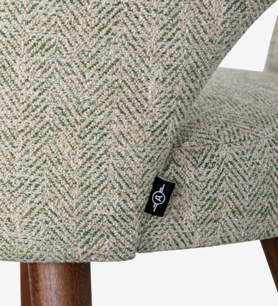 Paris Chair close-up of green-cream herringbone fabric with logo tag and wooden leg