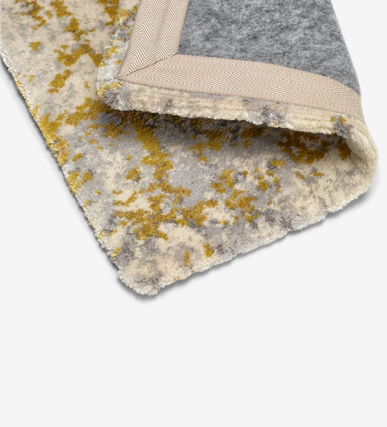 Abstract rug with grey and yellow tones, folded edge finish + 6mm feltex backing.