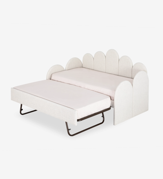 Lit de Divan avec structure et façade de tiroir rembourrées en tissu perle, avec lit dans le tiroir inférieur.