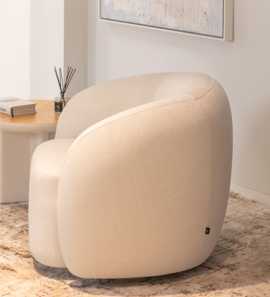 Armchair with a fully upholstered pearl-fabric finish and a swivel base.