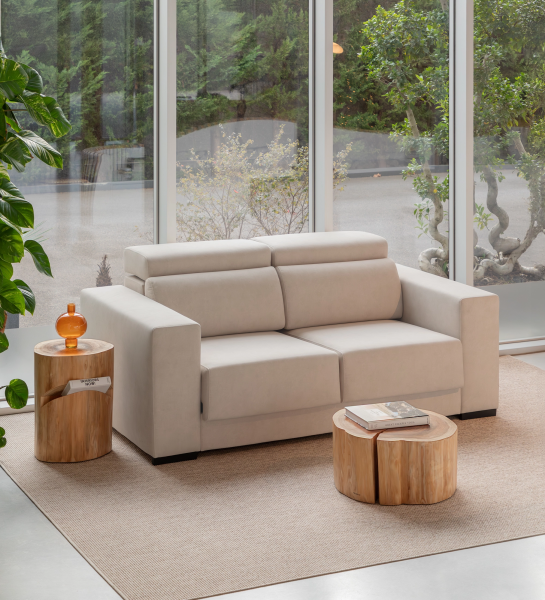 Oporto Sofa beige two-seater sofa in bright room with wooden side tables