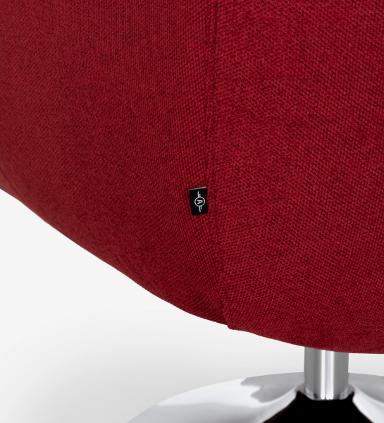 Paris Armchair close-up of red fabric upholstery seam, label and chrome base