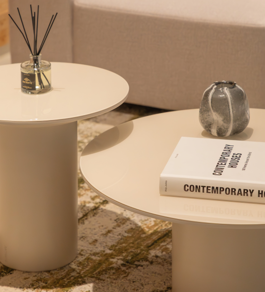 Paris Side Table pair in cream finish with book and ceramic vase