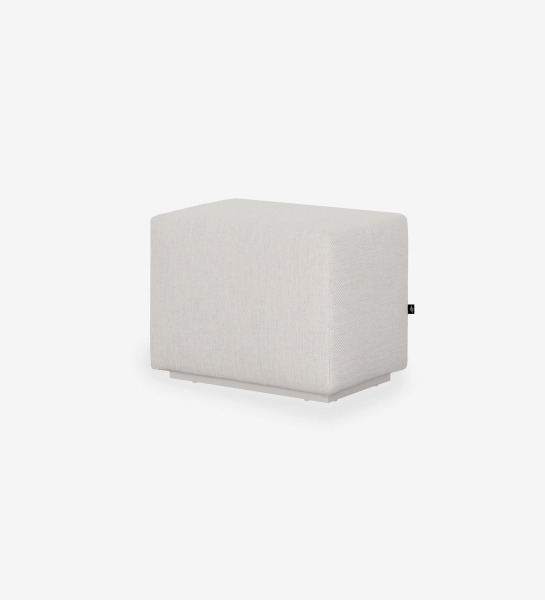 Pouf Nice rectangulaire en tissu beige clair avec étiquette noire sur le côté