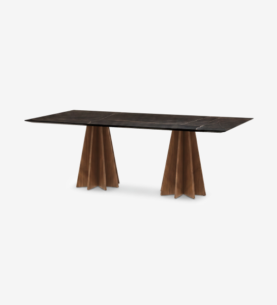 Lagos Dining Table with dark marble top and sculpted wooden double pedestal bases