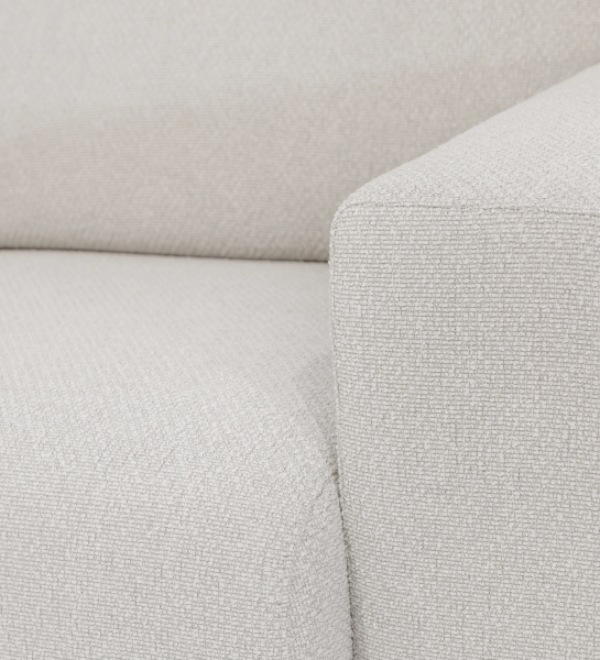 Canapé Lagos en tissu bouclé beige, accoudoir et assise en gros plan