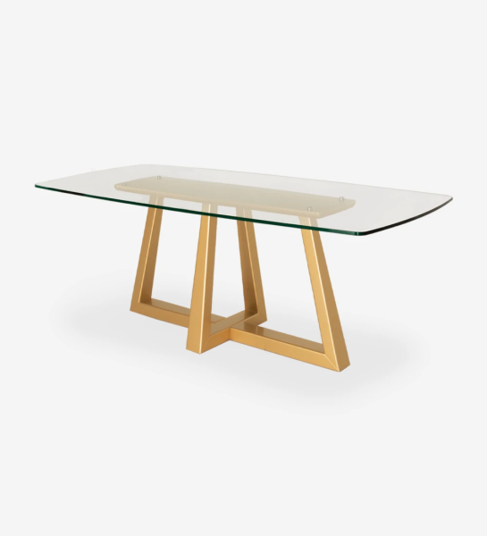 Rectangular dining table with glass top and gold lacquered center foot.