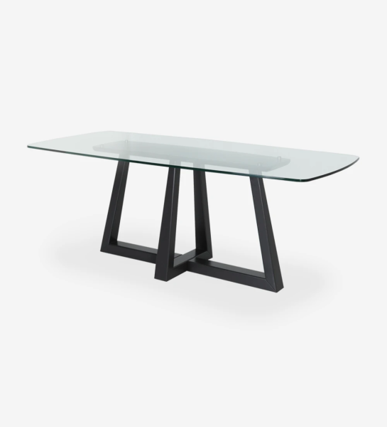 Rectangular dining table with glass top and black lacquered center foot.