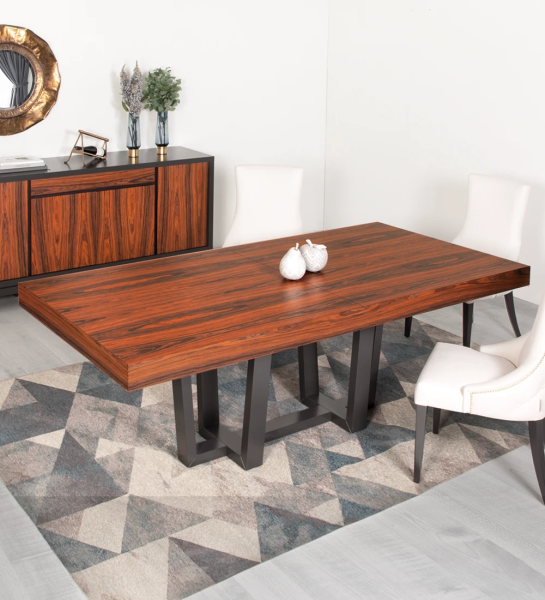 Rectangular extendable dining table with palissander top and black lacquered foot.