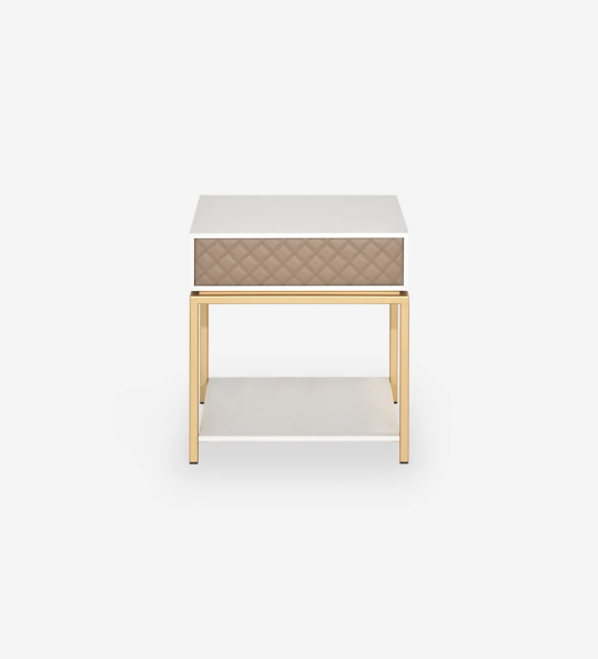 Bedside table with 1 drawer with fabric upholstered front, pearl lacquered frame, with gold lacquered metal foot.