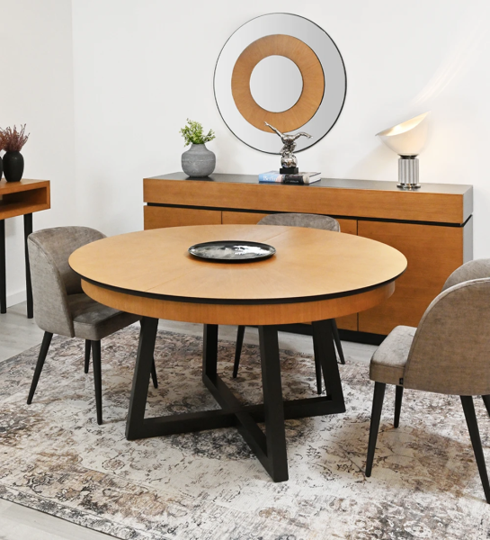 Round extendable dining table with honey oak top and black lacquered legs.